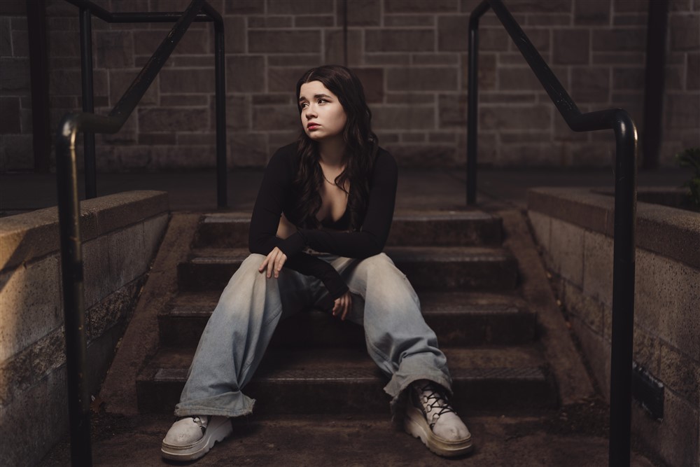 Tacoma senior portrait streetwear look on stone steps at Stadium High School