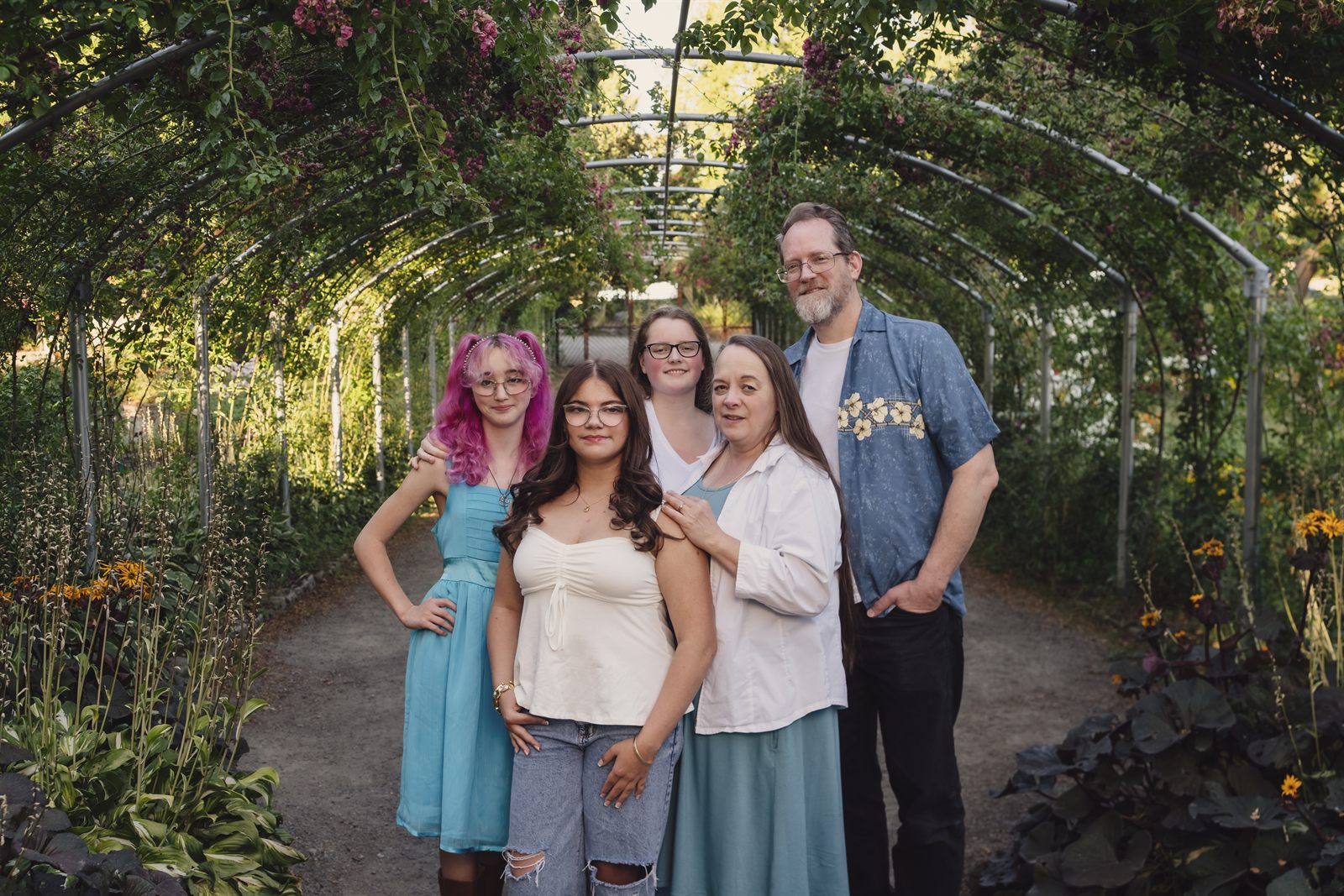 Family portraits inside the rose arbor tunnel at Point Defiance Rose Garden in Tacoma