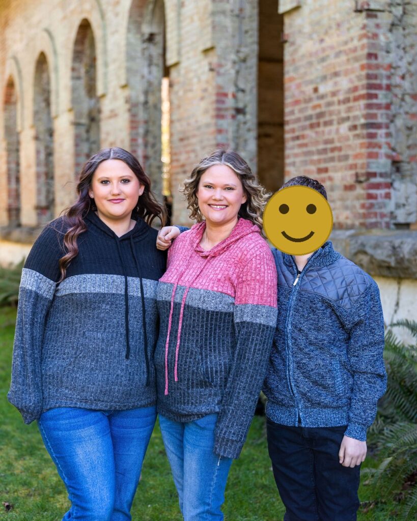 Mother with her two children by the historic brick arches during a family photo session at Manchester State Park in Washington