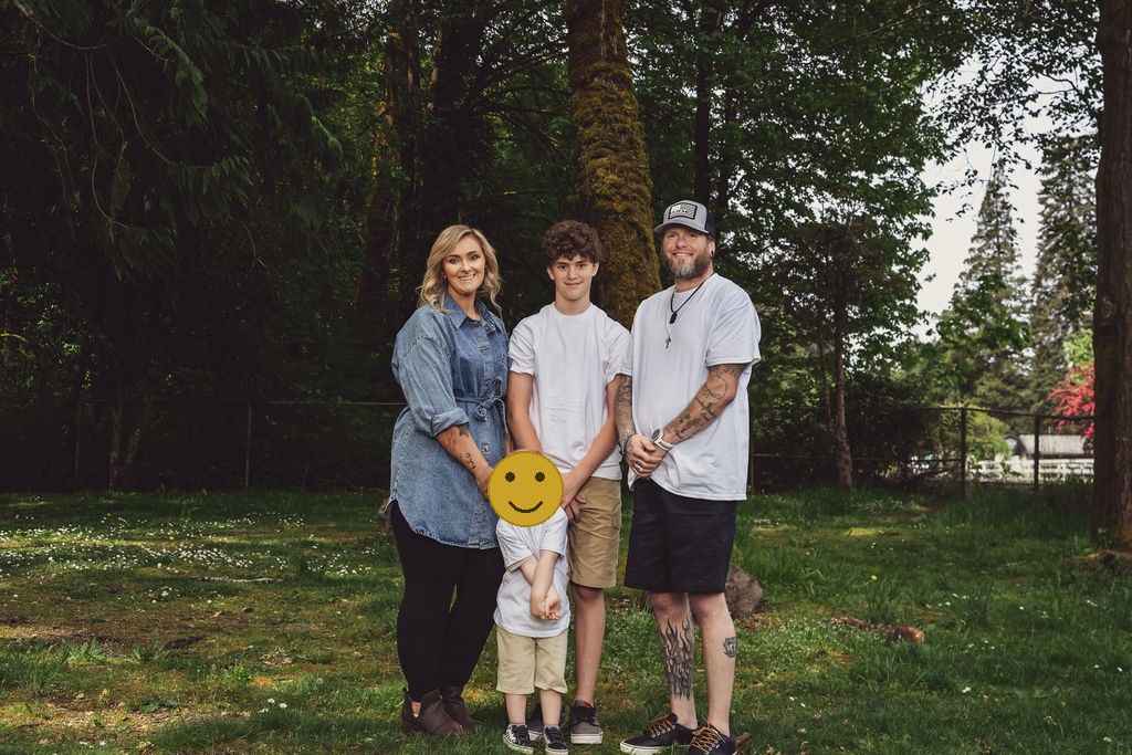 Coordinated family in relaxed, layered outfits at a Kitsap County outdoor photo session by Nautical Moments Photography, faces covered for privacy