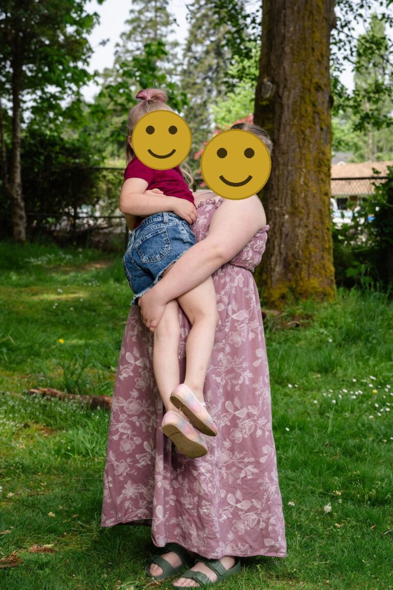 Two sisters posing together at a Kitsap County park