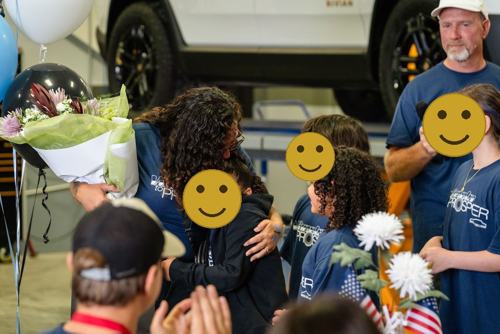 Mother embracing her daughter during an emotional car donation event in Tacoma