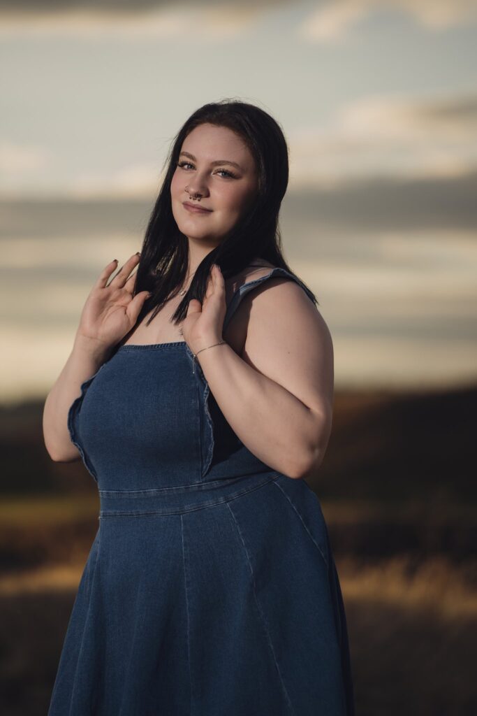 Golden hour senior portrait in a denim dress at Chambers Bay in University Place