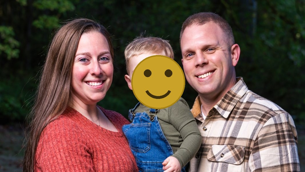 Family of three at a Bremerton Christmas tree farm, childs face covered for privacy