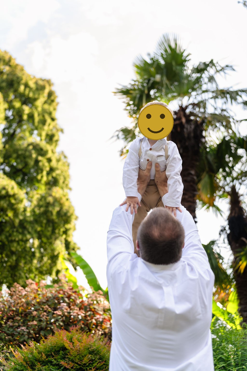 Dad lifting his son overhead during a family session at Point Defiance Park in Tacoma