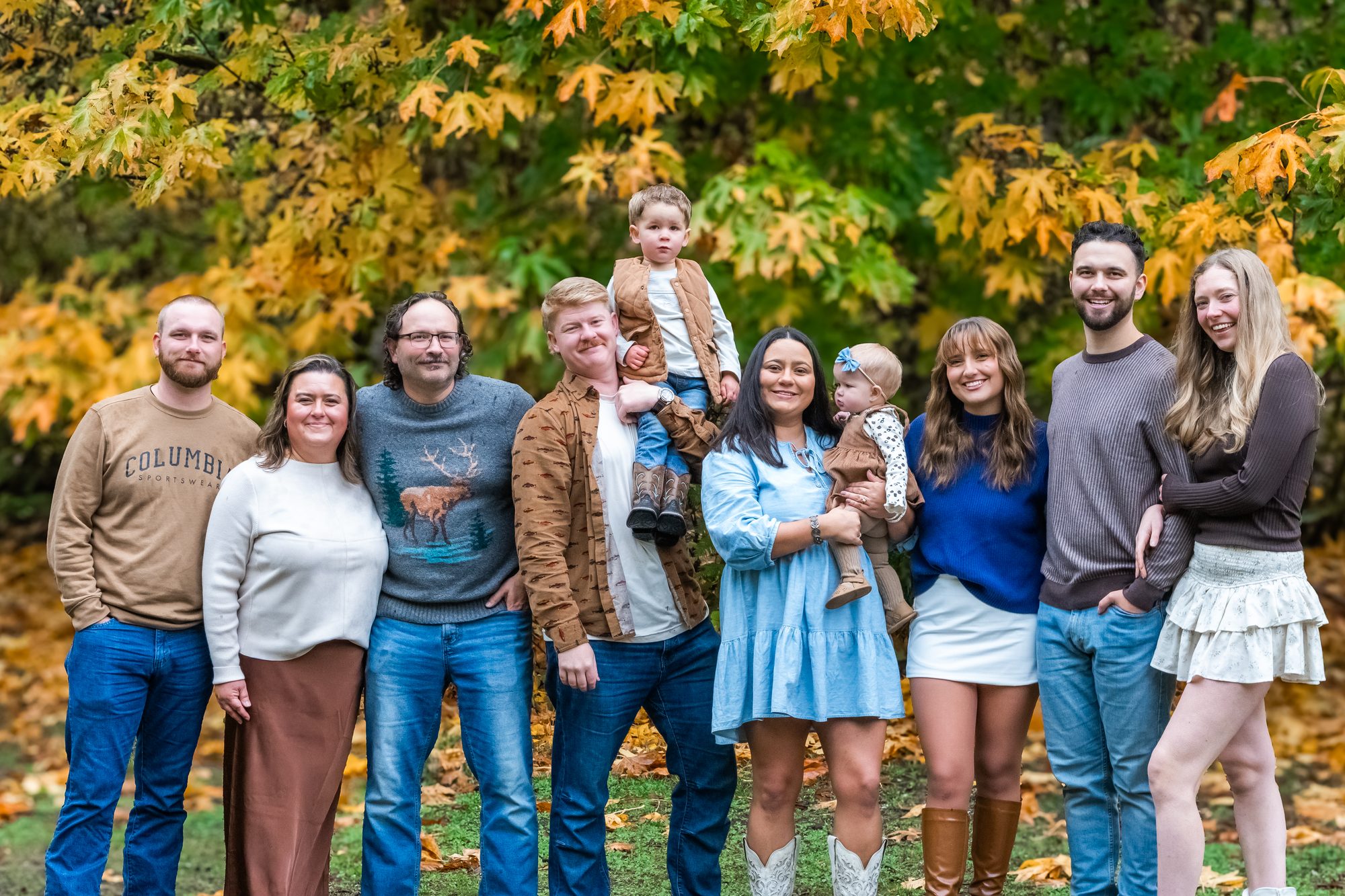 Extended family of ten photographed among golden fall maples at Manchester State Park in Kitsap County