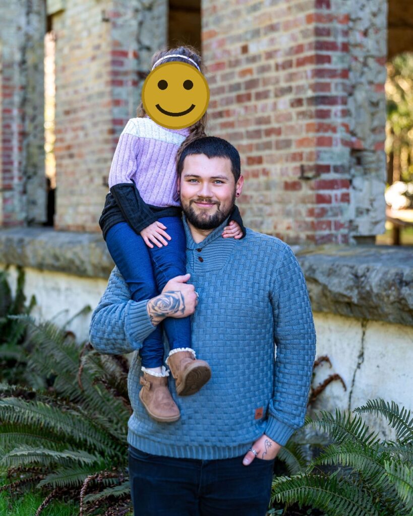 FATHER AND DAUGHTER IN FRONT OF MAIN BUILDING AT MANCHESTER STATE PARK.