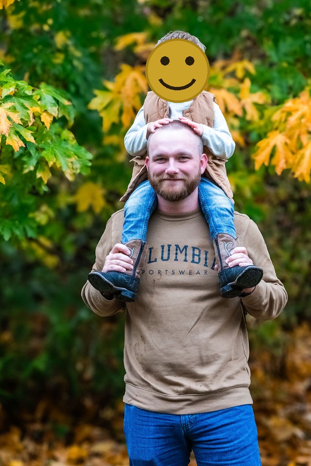 Father carrying his toddler on his shoulders during a fall family photo session in Kitsap County, Washington