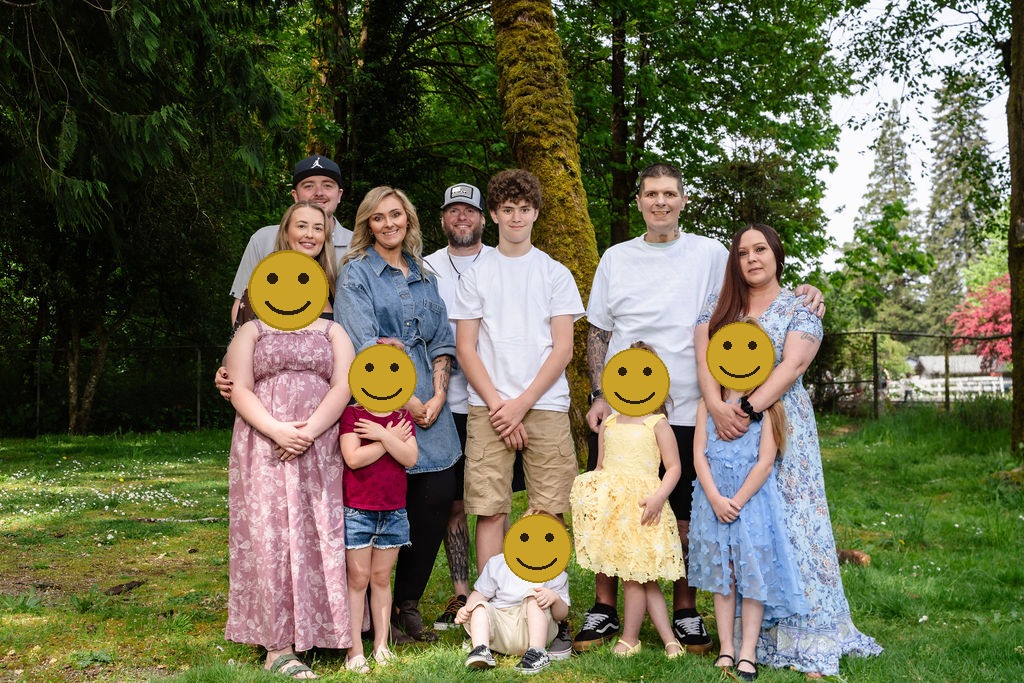 Extended family portrait among trees during an outdoor family photo session in Washington