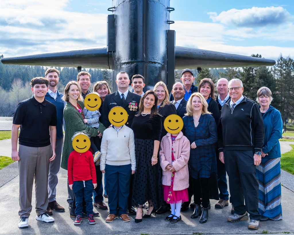Master chiefs family and friends in front of submarine during retirement ceremony at underwater naval museum in Bremerton.