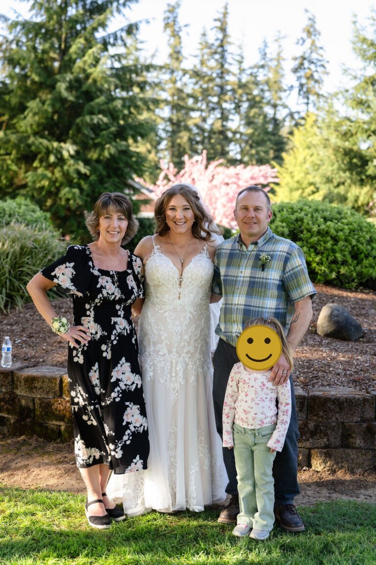 Bride with family at a Mason Jar Gathering Barn wedding in Onalaska, Washington