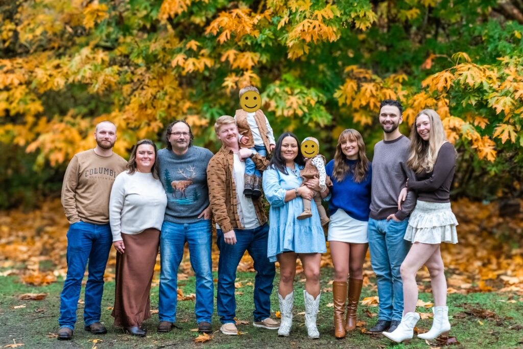 Family Posing with Fall leaves at Manchester State Park.